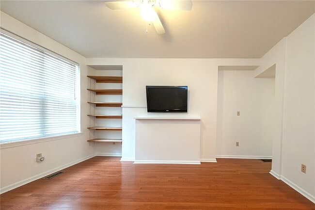 TV mounting rack for easy set up and built in shelves for lots of storage space - 114 Miltenberger St