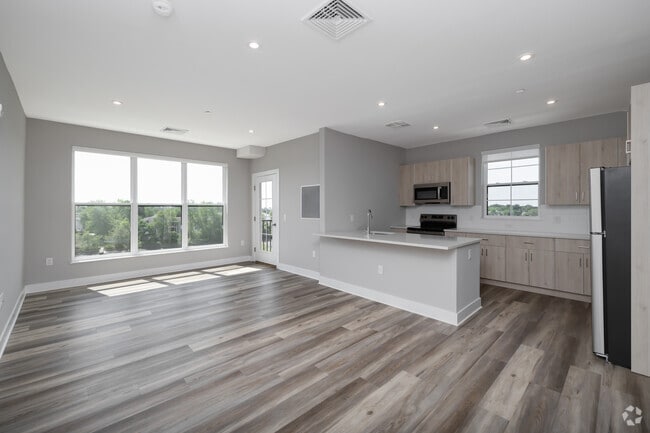 2BR, 2BA - 1,076 SF - Living Room and Kitchen - Creekline at Fairfield