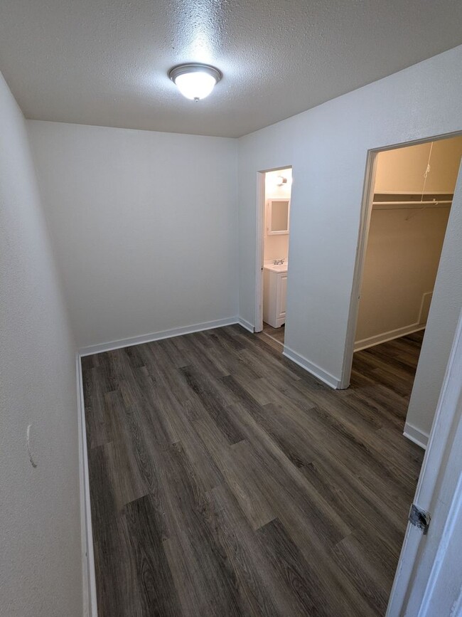 Photo - Ground Level 2 Bedroom, 2 Bath apartment. New flooring and paint. Tenant pays electric and natura...