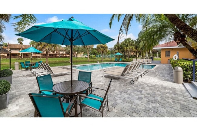 Enjoy the sparkling swimming pool and spacious sundeck at Midora at Woodmont - Midora at Woodmont