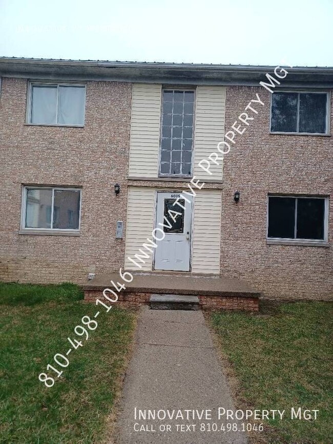 Building Photo - 6009 Holiday Gardens Dr Unit 4