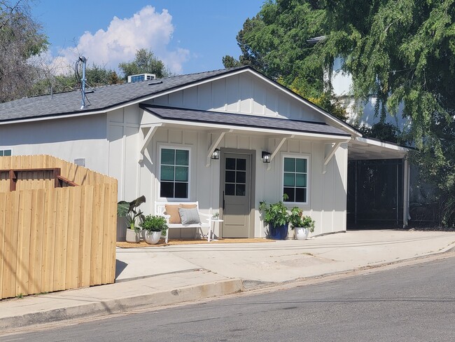 Front of the house. Note car port was demo'd per the city but the open parking pad is included. - 3649 Cazador Dr Casa