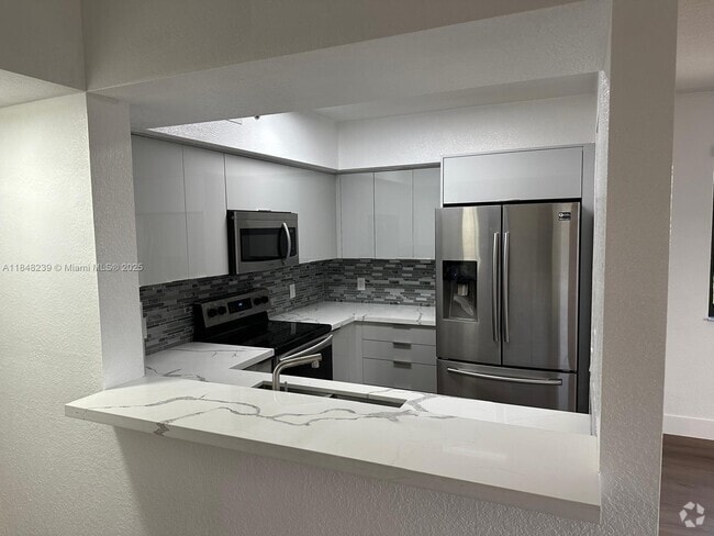 Building Photo - 9300 Fontainebleau Blvd Unit E414 Rental