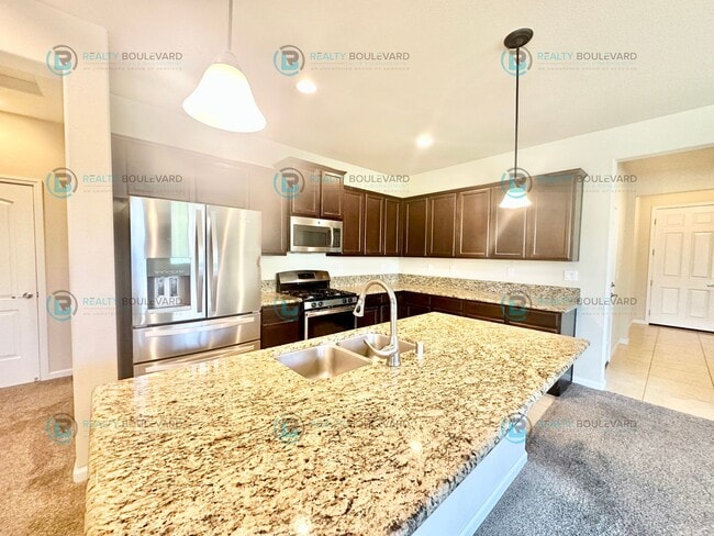Photo - 3 Bedroom 2 Bathroom with Garage covered patio and beautiful yard!