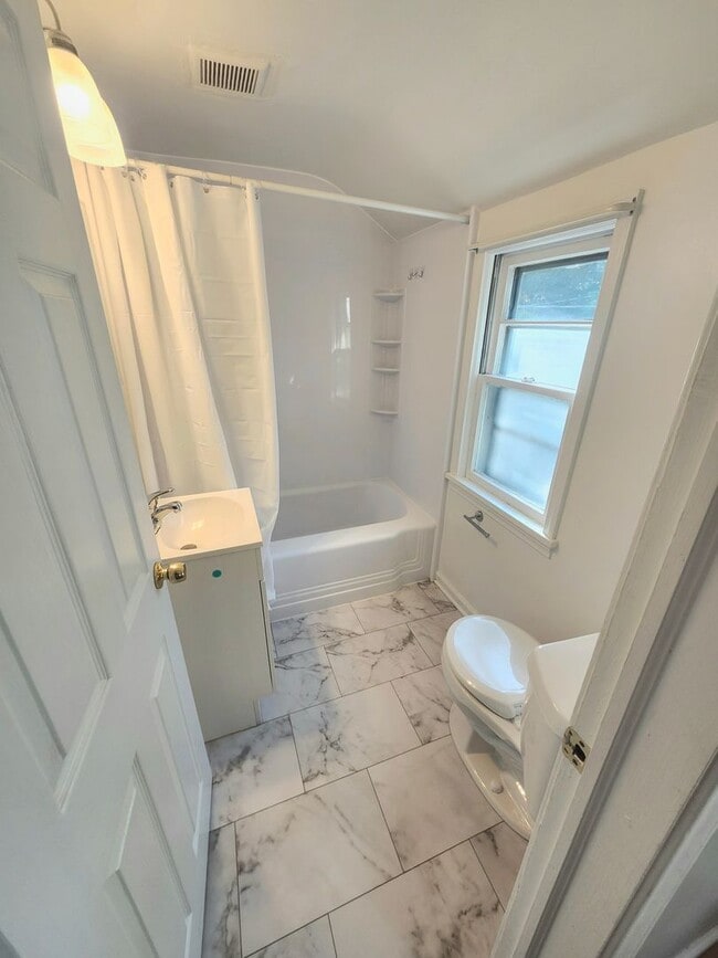 Photo - Spacious 4bd apt | Laundry hooks ups | Off street parking