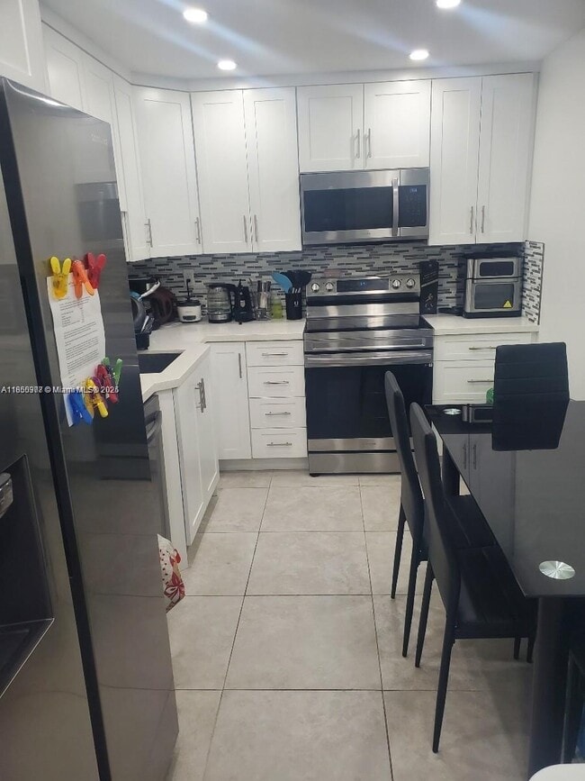 Building Photo - 10777 W Sample Rd Unit 1217 Rental