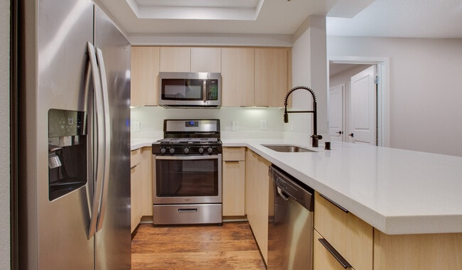 Kitchen includes granite countertops and stainless steel appliances