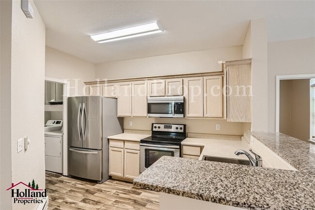 Photo - Comfort Meets Convenience: Updated 2-Bed Condo with Garage & Pool