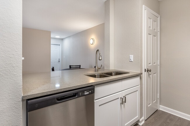 Step into the elegance of this contemporary kitchen, perfect for any culinary enthusiast. - Village Green Student Housing