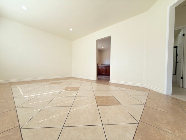 Photo - Spacious 4-Bedroom, 2-Bath Gated Home with Garage & Private Backyard