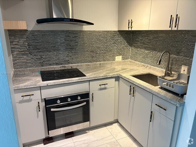 Building Photo - 7904 West Dr Unit 103 Rental