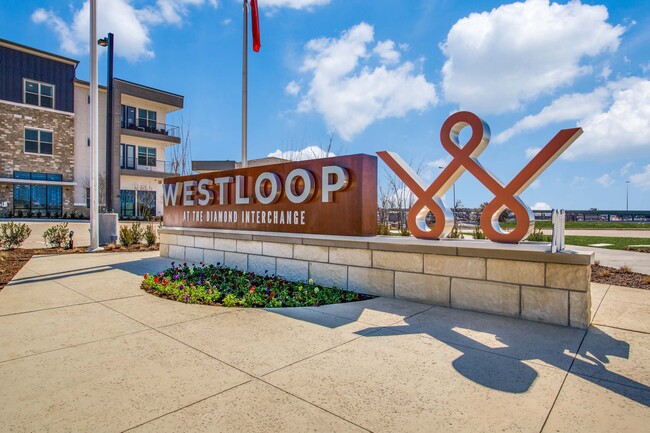 Community entrance sign - Westloop Apartments