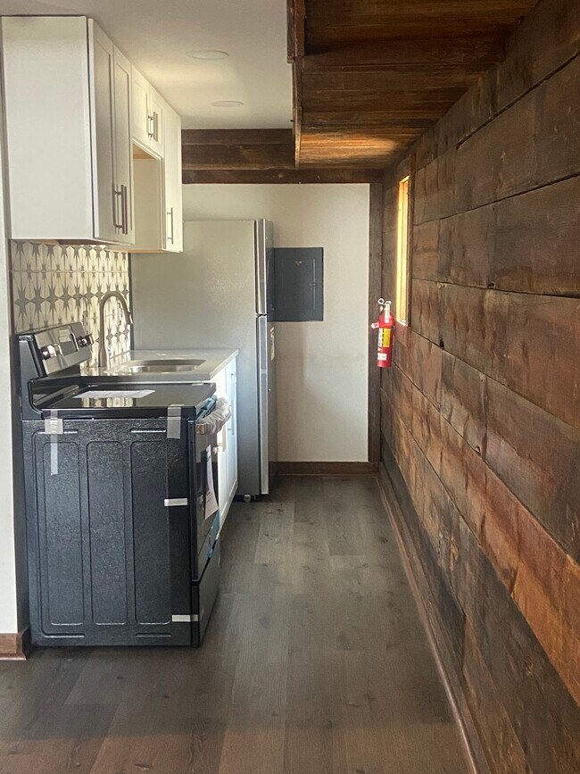 New stainless appliances in galley kitchen - 5 S Batavia Ave Unidad Coach House