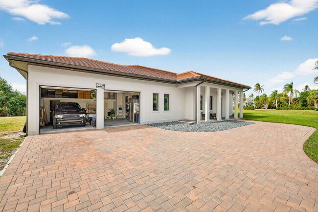 Newly built upscale home on a private 1-acre lot in the quiet Bell Villa community of Bonita Spri...