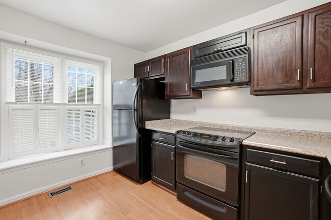 Photo - Welcome home to this charming three-level townhouse in the heart of Springfield!