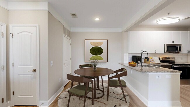 Newly Renovated Dining Room with Hardwood-Style Flooring - Creekstone at RTP Apartments