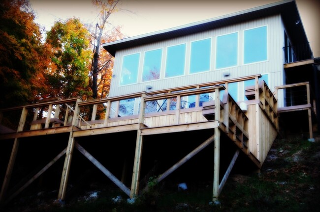 Wall of windows gives lake view from every room - 8174 Pine Ln House