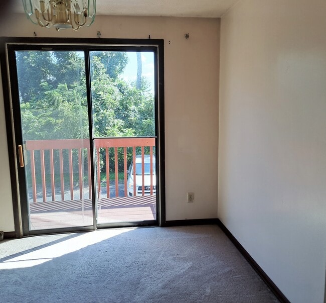 Dining area with view of private deck and additional parking for second car and guest cars - 3812 Lebanon Church Rd