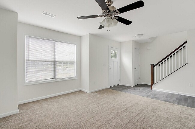 Step into a welcoming living space filled with natural light and modern design.