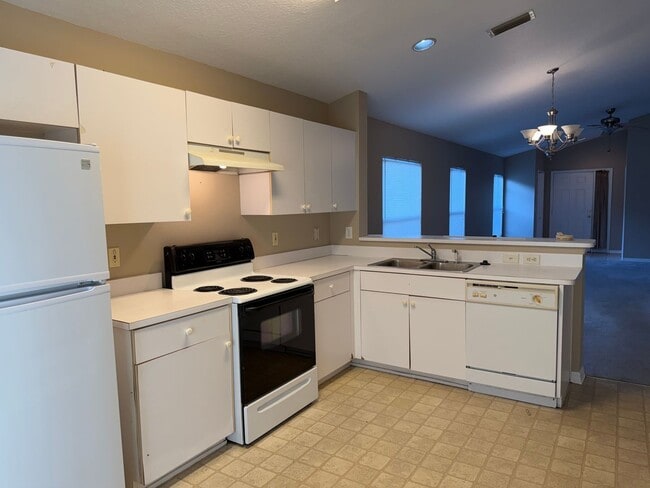 Photo - VALRICO home with fenced yard and screened lanai