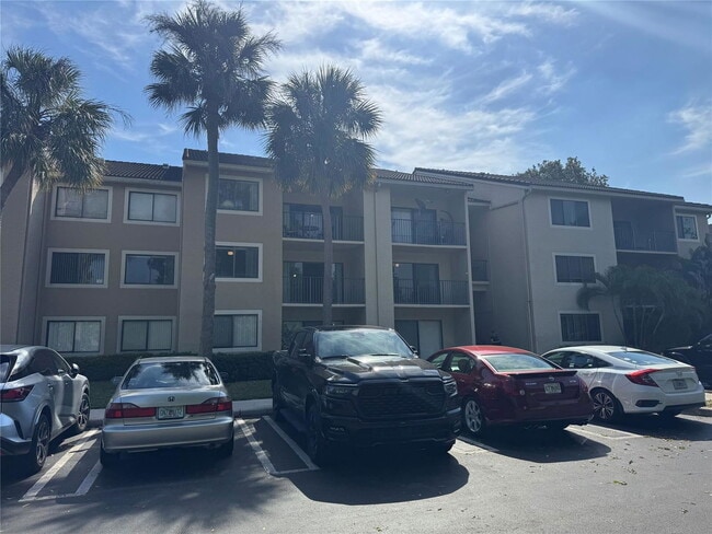 Building Photo - 9001 Wiles Rd Unit 305 Rental