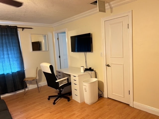 view of desk and smart TV - 600 NW 7th Ave Unit 2