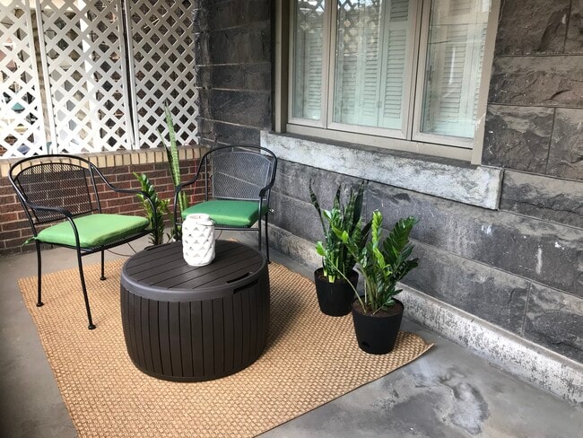 Porch seating area overlooking Dawson Street - 3284 Dawson Street Unit Apartment 2