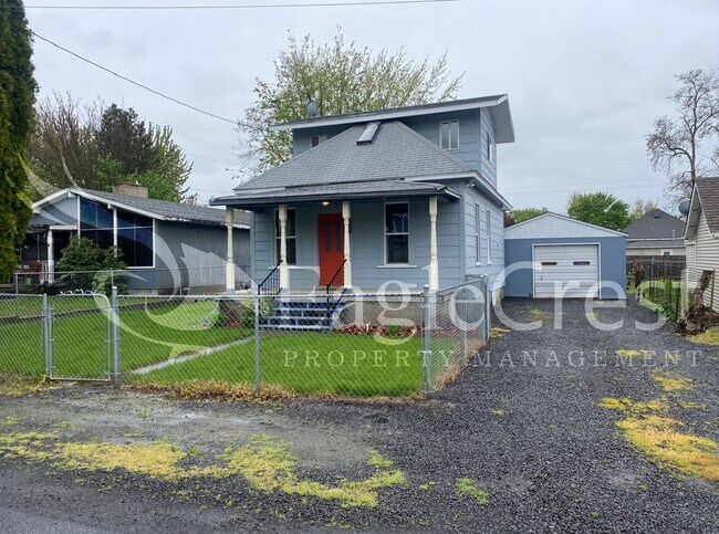 Charming 2 Bedroom Home With 1 Car Garage and A Covered Porch