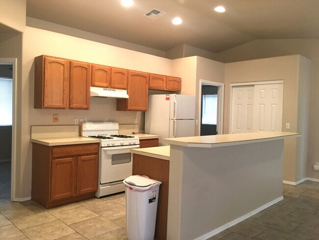 Photo - 3-Bedroom Single Family Home with Central Cooling, Attached Garage, and Tile Flooring