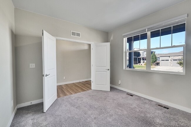 Photo - $3,340.95 - 5 Bed, 3 Bath Home in Thornton with Cozy Fireplace and Fenced-in Yard