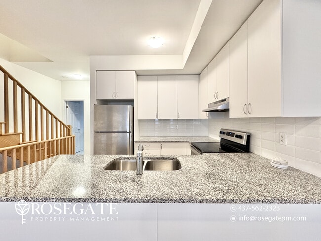 Photo - Massive 5-Bedroom + Den Townhouse with Garage & Deck in Oshawa