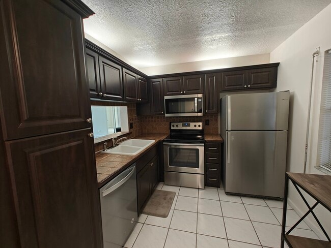 Building Photo - 8750 Royal Palm Blvd Unit 111