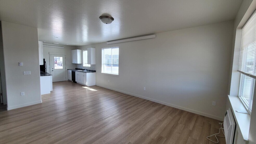 End Unit Living room looking toward kitchen.