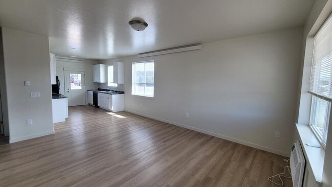End Unit Living room looking toward kitchen.
