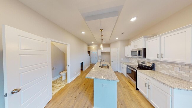 Photo - Stylish Home with Feature Stone Front Fireplace, Open Layout and Premium Upgrades