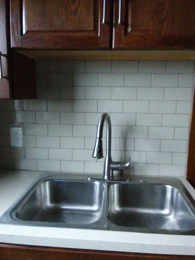 kitchen w stainless steel sink, and appliznce - 3210 Main St