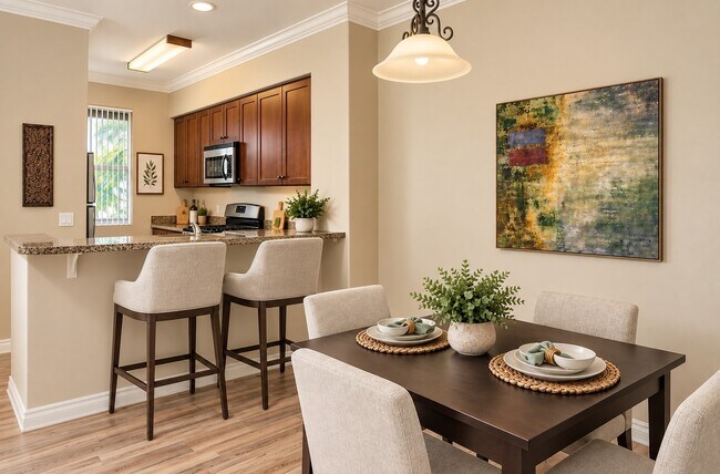 Elevate your lifestyle at The Pointe with this inviting dining space and modern kitchen, perfect for gatherings. Enjoy stylish interiors and serene surroundings. Don't miss out—schedule a visit today!