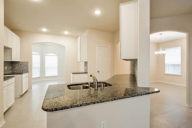 Photo - Beautiful stone front 4 bedroom, 3 bath home has bay windows in breakfast nook & master. It is on...