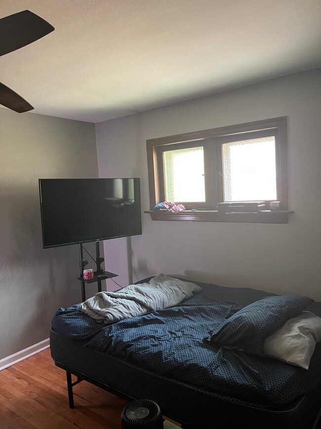 Bedroom with full size bed and flat screen smart tv - 6139 Alaska Ave Unit 6139