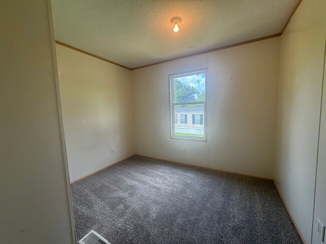 Photo - Charming 3/1 Mobile Home in Quiet Park w/ Well, Septic, & Lawn Maintenance
