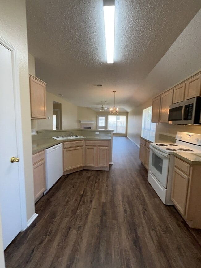 Photo - Welcome home to this spacious 3-bedroom, 2-bath home offering approximately 1,763 square feet of ...