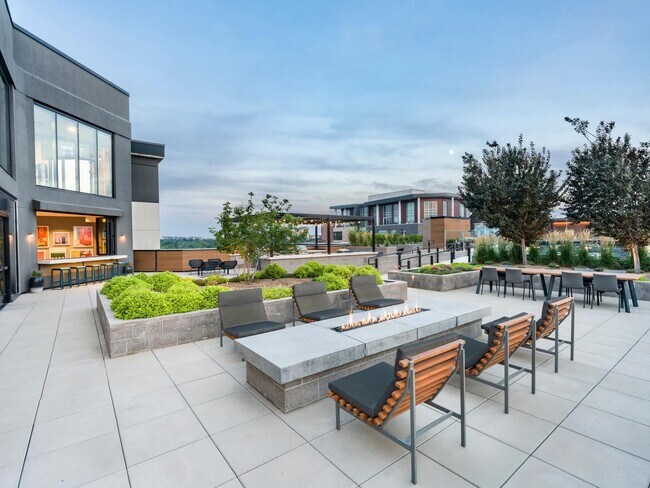 Enjoy the rooftop terrace with fire pits, dining areas, and skyline views.
