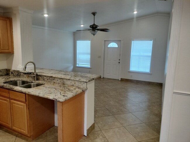 Photo - Beautiful home with fenced in backyard!