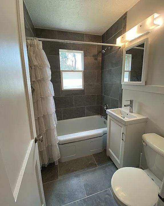 Bathroom with tub and shower - 3535 Apple St Apartments Unit 3535 Apple Street