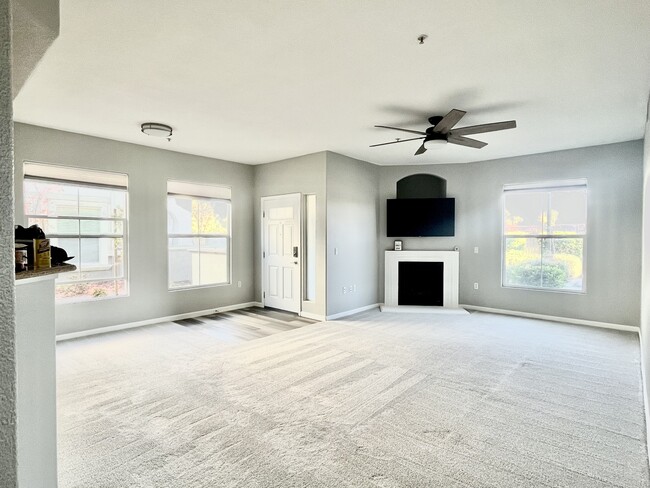 Entryway and living room - 5578 Tares Cir Condo Unit 5578