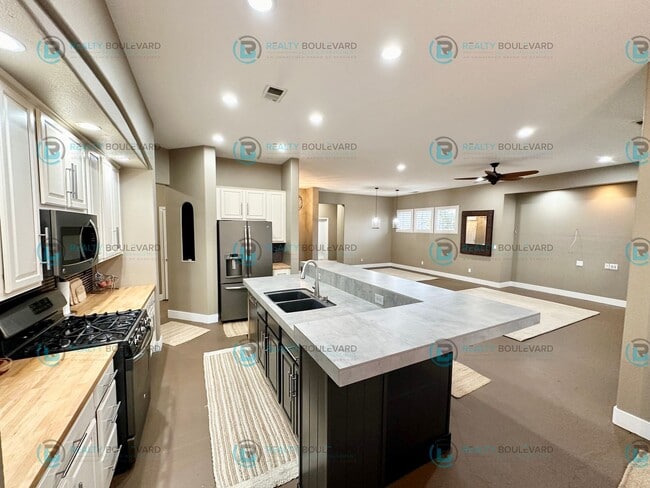 Photo - Open Kitchen, Expansive Living, and Covered Patio in Tranquil South Reno Near Trails, Parks & Sho...