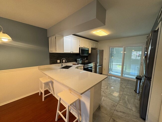 Photo - Charming 2-Bedroom Condo with Pool Access & Water Included – Prime Orlando Location