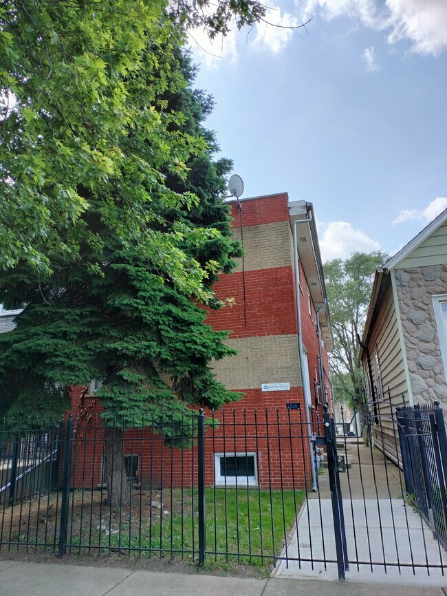 Building Photo - 7910 S Muskegon Ave Unit 1