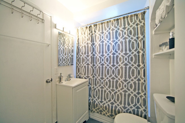 MODERN FIXTURES IN QUAINT BATHROOM