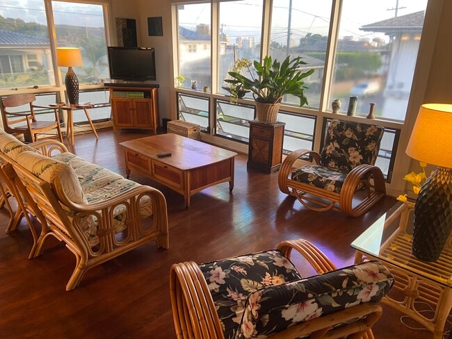 Bright living room surrounded by windows – full of morning light - 2424 Lanai St House